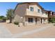 Two-story exterior with desert landscaping and neutral color palette, showcasing the property's facade at 3605 W Bethany Home Rd # 7, Phoenix, AZ 85019