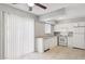 Bright kitchen featuring a window, a set of white appliances, and a sink at 3605 W Bethany Home Rd # 7, Phoenix, AZ 85019