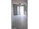 Bright living room with a sliding glass door leading to a yard at 3605 W Bethany Home Rd # 7, Phoenix, AZ 85019