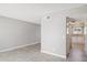 View of an empty living room with wood floors, and entrance to the kitchen at 3605 W Bethany Home Rd # 7, Phoenix, AZ 85019