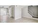 View of an empty living room with wood floors, and a stairway to the second level at 3605 W Bethany Home Rd # 7, Phoenix, AZ 85019