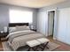 Cozy main bedroom featuring neutral tones, a comfortable bed, and ample closet space at 3605 W Bethany Home Rd # 7, Phoenix, AZ 85019