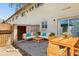 Outdoor patio with wooden furniture, including a dining set and lounge area, perfect for entertaining at 3605 W Bethany Home Rd # 7, Phoenix, AZ 85019