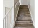 A stairway to the second level with wooden floors at 3605 W Bethany Home Rd # 7, Phoenix, AZ 85019