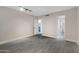 Bedroom featuring a large window, track lighting, and gray wood-look tile floors at 4165 E Huntington Dr, Phoenix, AZ 85040