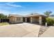 Charming single-story home featuring a spacious driveway and covered parking area at 4165 E Huntington Dr, Phoenix, AZ 85040