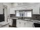 Bright kitchen featuring stainless steel appliances, granite countertops, and tiled backsplash at 4165 E Huntington Dr, Phoenix, AZ 85040