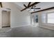 Large living area with exposed beams, wood-look floors, and natural light at 4165 E Huntington Dr, Phoenix, AZ 85040