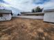Backyard shot showcasing large dirt area with shed and fencing on the lot at 4210 W Solano Dr, Phoenix, AZ 85019