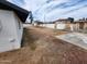 A spacious, enclosed backyard with dirt and potential for landscaping and outdoor activities at 4210 W Solano Dr, Phoenix, AZ 85019