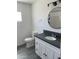 Bathroom featuring white cabinets with a black countertop and black hardware at 4210 W Solano Dr, Phoenix, AZ 85019