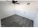 Bedroom featuring hardwood flooring, a ceiling fan, and a door at 4210 W Solano Dr, Phoenix, AZ 85019