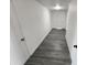 The home features a long hallway with fresh paint, new flooring, and updated lighting at 4210 W Solano Dr, Phoenix, AZ 85019
