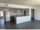 Kitchen with center island, gray laminate flooring and neutral walls at 4210 W Solano Dr, Phoenix, AZ 85019
