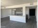 Open concept kitchen boasts gray cabinets, white counter tops, and stainless steel appliances at 4210 W Solano Dr, Phoenix, AZ 85019