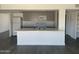 Kitchen with an island and view of stainless steel appliances and gray cabinets at 4210 W Solano Dr, Phoenix, AZ 85019