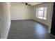 Living Room featuring gray laminate flooring, neutral paint, and ceiling fan at 4210 W Solano Dr, Phoenix, AZ 85019