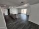 Open-concept living space featuring a kitchen island and modern flooring at 4210 W Solano Dr, Phoenix, AZ 85019