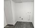 A utility room with new flooring and fresh paint offers potential for storage or customization at 4210 W Solano Dr, Phoenix, AZ 85019