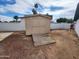 A tan storage shed on a dirt lot provides space for tools and equipment at 4210 W Solano Dr, Phoenix, AZ 85019
