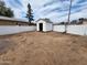 The backyard features a white shed, offering additional storage space in a low-maintenance yard at 4210 W Solano Dr, Phoenix, AZ 85019
