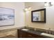 Bathroom features double sinks, a framed mirror, and calming artwork at 441 E Encinas Ave, Gilbert, AZ 85234