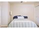 Bright bedroom with shuttered windows and a plush throw on the modern striped comforter at 441 E Encinas Ave, Gilbert, AZ 85234
