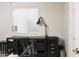 Home office with desk, a window with blinds, and a functional black office chair at 441 E Encinas Ave, Gilbert, AZ 85234