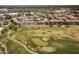 Stunning aerial view of a golf course community with lush greens and well-maintained condominium buildings at 4455 E Paradise Village Pkwy # 1051, Phoenix, AZ 85032