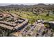 Expansive aerial view of a golf course community with well-manicured lawns, complex, and mountain backdrop at 4455 E Paradise Village Pkwy # 1051, Phoenix, AZ 85032