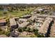 High-angle view of a condo community boasting a pool, golf course views, and mature trees at 4455 E Paradise Village Pkwy # 1051, Phoenix, AZ 85032