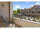 View from the balcony featuring patio chairs and the community landscape at 4455 E Paradise Village Pkwy # 1051, Phoenix, AZ 85032