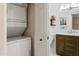 Bathroom view with a shower and vanity, adjacent to a stackable washer and dryer at 4455 E Paradise Village Pkwy # 1051, Phoenix, AZ 85032