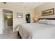 Bedroom with view of closet, neutral walls and carpets, and comfortable furnishings at 4455 E Paradise Village Pkwy # 1051, Phoenix, AZ 85032