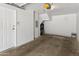 Clean garage with painted walls and concrete floors with access door at 4455 E Paradise Village Pkwy # 1051, Phoenix, AZ 85032
