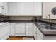 Bright kitchen with white cabinets, modern appliances, and a sleek faucet at 4455 E Paradise Village Pkwy # 1051, Phoenix, AZ 85032
