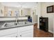Modern kitchen featuring white cabinets, stainless steel sink, and a functional layout at 4455 E Paradise Village Pkwy # 1051, Phoenix, AZ 85032