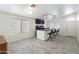 Spacious wet bar area featuring a granite counter, storage cabinets, and sleek seating at 46141 W Amsterdam Rd, Maricopa, AZ 85139