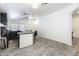 A fully equipped wet bar area with dark cabinets, a counter, and seating for entertaining at 46141 W Amsterdam Rd, Maricopa, AZ 85139
