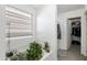 Bright bathroom with a tub featuring plants and storage, complemented by natural light at 46141 W Amsterdam Rd, Maricopa, AZ 85139