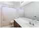 Bathroom features a vanity and mirror as well as a bathtub with shower at 46141 W Amsterdam Rd, Maricopa, AZ 85139
