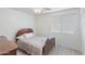 Neutral bedroom with a ceiling fan and a window allowing for natural light at 46141 W Amsterdam Rd, Maricopa, AZ 85139