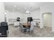 Spacious dining area with a wooden table, seating, and modern lighting, open to the adjacent kitchen at 46141 W Amsterdam Rd, Maricopa, AZ 85139
