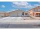 Inviting single-Gathering home featuring a desert landscape, two-car garage, and a charming front patio at 46141 W Amsterdam Rd, Maricopa, AZ 85139