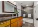 Bright bathroom featuring modern fixtures, granite countertop and a shower with glass door at 5221 E Tunder Cir, Phoenix, AZ 85044