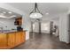 A well-lit living room featuring granite countertops and modern appliances with ceiling fan at 5221 E Tunder Cir, Phoenix, AZ 85044