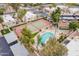 Community aerial view showcasing pool, tennis court, palm trees, spa and carports in a well-maintained neighborhood at 536 S Evergreen Rd, Tempe, AZ 85288