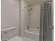 Bathroom with a shower-tub combo and a shower curtain with white tile surround at 536 S Evergreen Rd, Tempe, AZ 85288