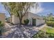 Cozy single-story home featuring a low-maintenance front yard and an appealing neutral-toned exterior with a mature shade tree at 536 S Evergreen Rd, Tempe, AZ 85288