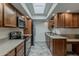 Well-equipped kitchen featuring granite countertops, stainless steel appliances, and tiled floors at 536 S Evergreen Rd, Tempe, AZ 85288